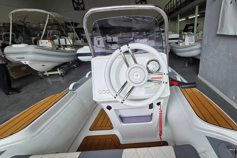 Slide: The Image of Interior view of 2026 Gala Viking V330 boat with Tohatsu 30HP engine, featuring sleek design. - 3