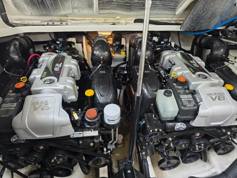 Slide: The Image of The engine room of a 2017 Sea Ray Sundancer 350 Coupe with two powerful engines. - 39