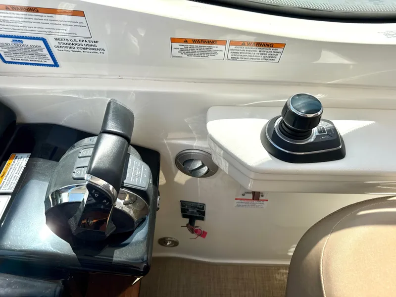 Slide: The Image of Control console of the 2017 Sea Ray Sundancer 350 Coupe with controls. - 17