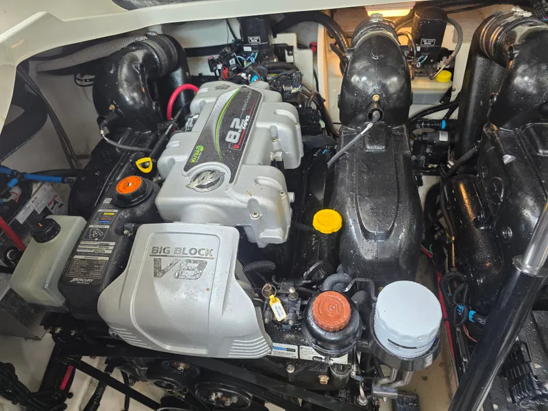 Slide: The Image of The engine compartment of a 2017 Sea Ray Sundancer 350 Coupe features a powerful V8 engine. - 41