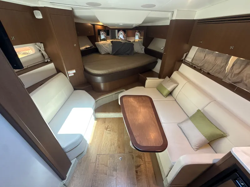 Slide: The Image of Interior of the 2017 Sea Ray Sundancer 350 Coupe with elegant seating and wooden flooring. - 27