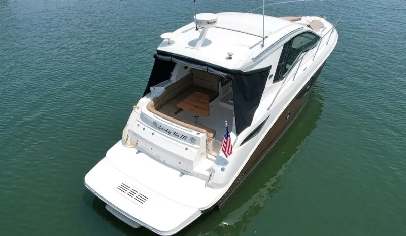 Slide: The Image of 2017 Sea Ray Sundancer 350 Coupe on calm water. - 2