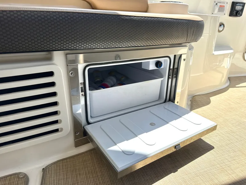 Slide: The Image of An open cooler compartment on a boat with drinks inside. - 12