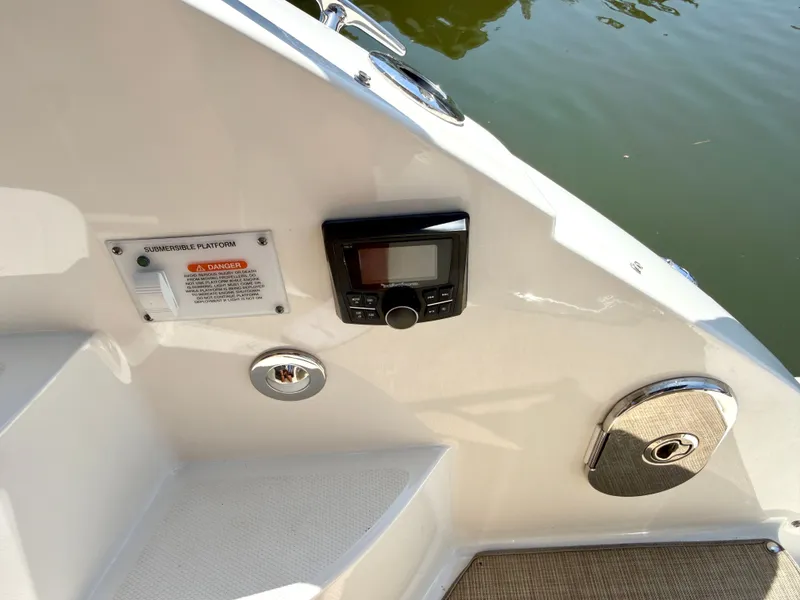 Slide: The Image of Close-up of the control area on a 2017 Sea Ray Sundancer 350 Coupe. - 7
