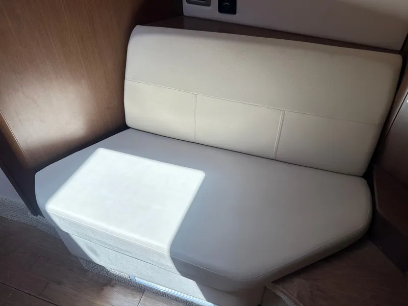 Slide: The Image of Interior of the 2017 Sea Ray Sundancer 350 Coupe with beige seating. - 31