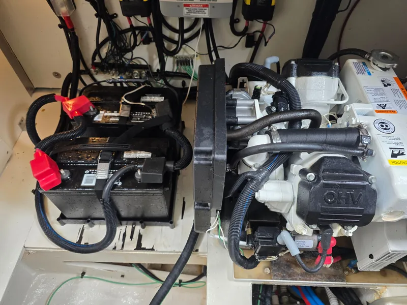 Slide: The Image of View of the engine room in a 2017 Sea Ray Sundancer 350 Coupe with batteries and engine. - 44