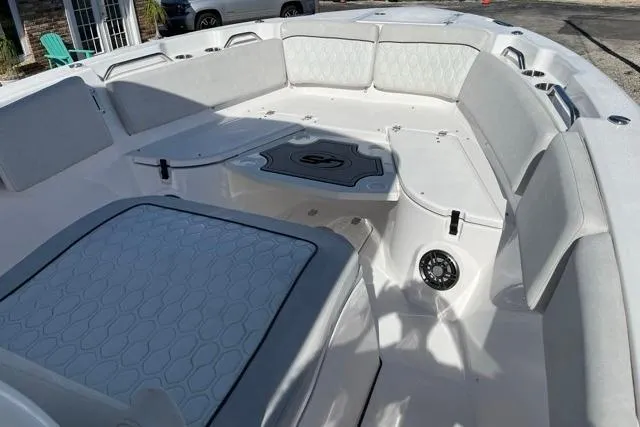 Slide: The Image of 2023 Seafox 268 boat interior with cushioned seating and modern design. - 7