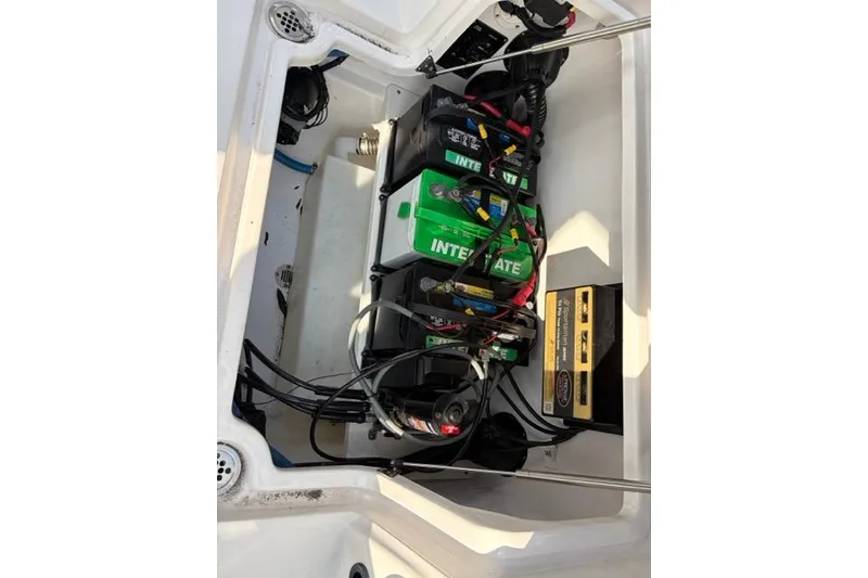 Slide: The Image of 2023 Seafox 268 boat battery compartment with Interstate batteries and wiring. - 20