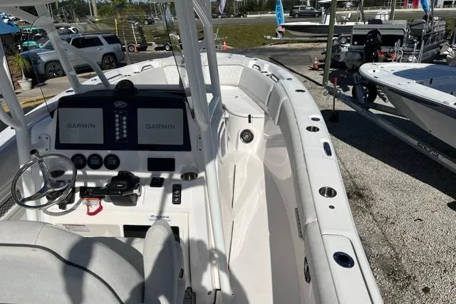 Slide: The Image of 2023 Seafox 268 boat with Garmin navigation, sleek design, and spacious deck. - 4