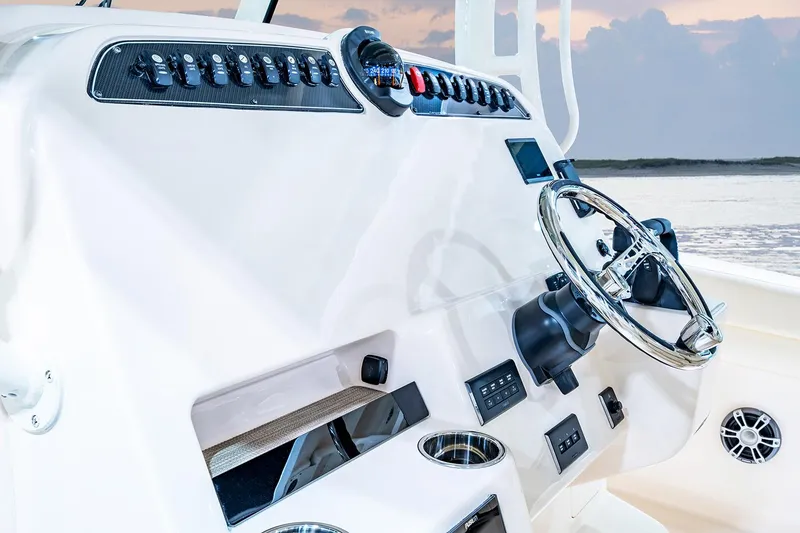 Slide: The Image of Manufacturer Provided Image: 2025 Grady-White Canyon 336 helm with modern controls and steering wheel. - 8