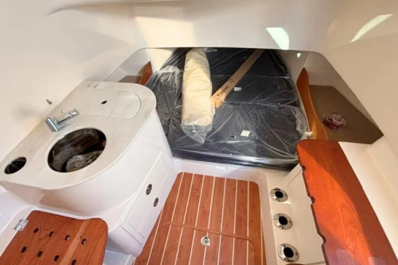 Slide: The Image of Interior of 2025 Grady-White Canyon 336 boat with sink and wooden flooring. - 26