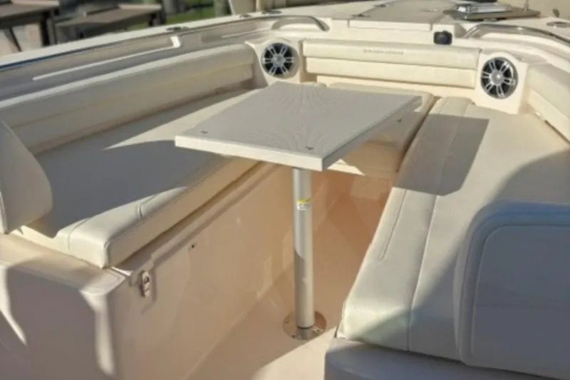 Slide: The Image of 2025 Grady-White Canyon 336 boat interior with seating and table. - 22