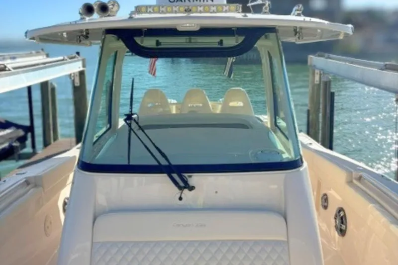 Slide: The Image of 2025 Grady-White Canyon 336 boat docked, showcasing sleek design and modern features. - 21