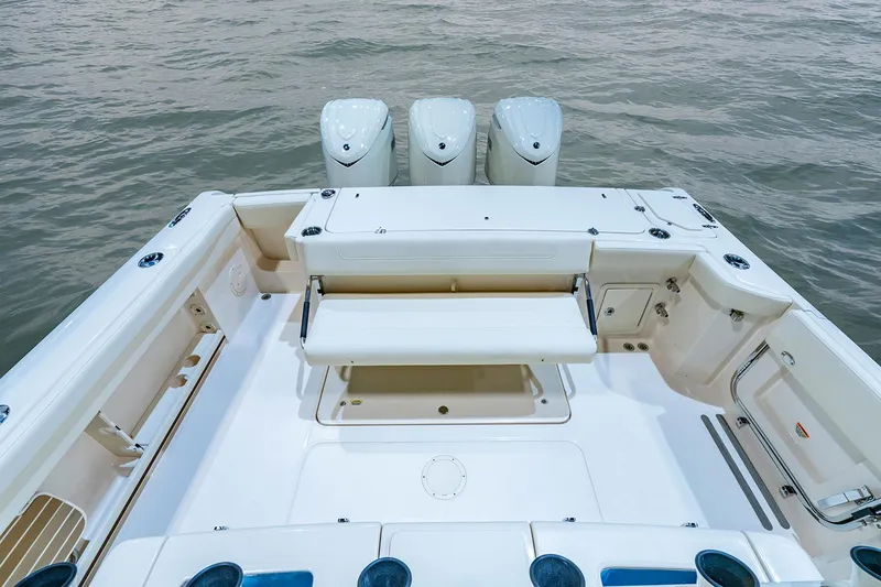 Slide: The Image of Manufacturer Provided Image: 2025 Grady-White Canyon 336 boat deck with triple outboard engines. - 9