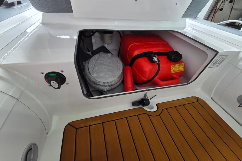 Slide: The Image of Storage compartment of 2026 Gala Viking V330 boat with Yamaha 25HP engine, featuring red fuel tank. - 6