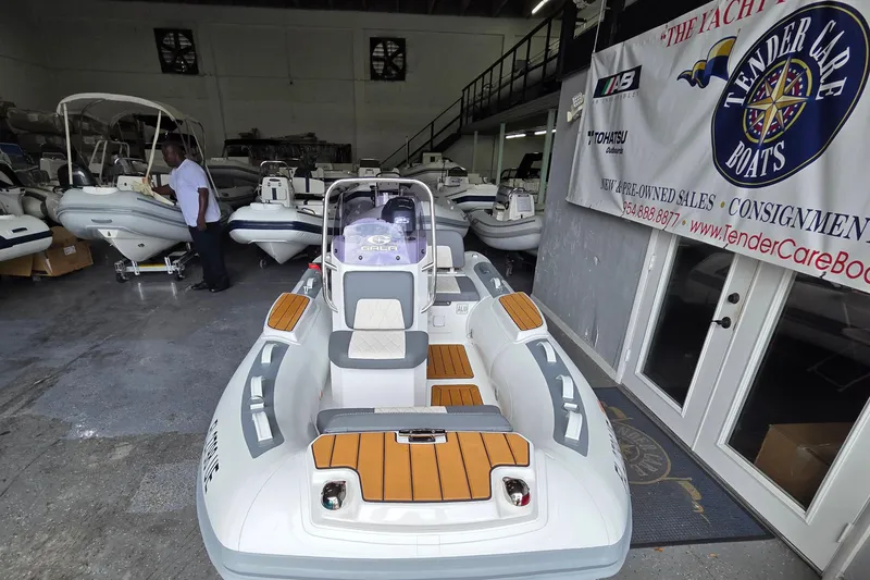 Slide: The Image of 2026 Gala Viking V330 boat with Yamaha 25HP engine in showroom. - 2