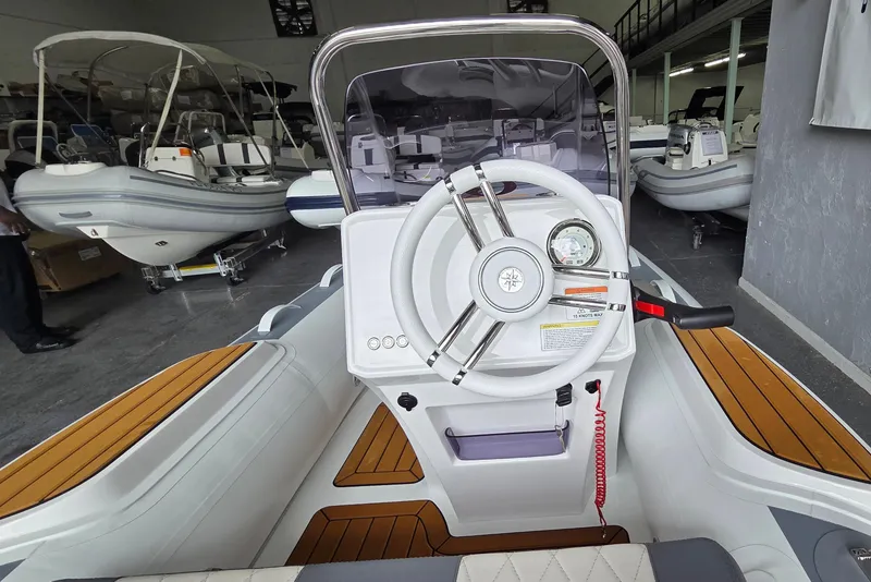 Slide: The Image of Interior view of 2026 Gala Viking V330 boat with Yamaha 25HP engine in showroom. - 4