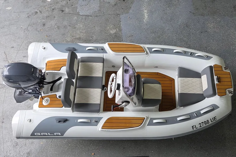 Slide: The Image of 2026 Gala Viking V330 boat with Yamaha 25HP engine, featuring sleek design and comfortable seating. - 1