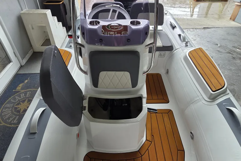 Slide: The Image of 2026 Gala Viking V330 boat interior with Yamaha 25HP engine, featuring sleek design and wood accents. - 3