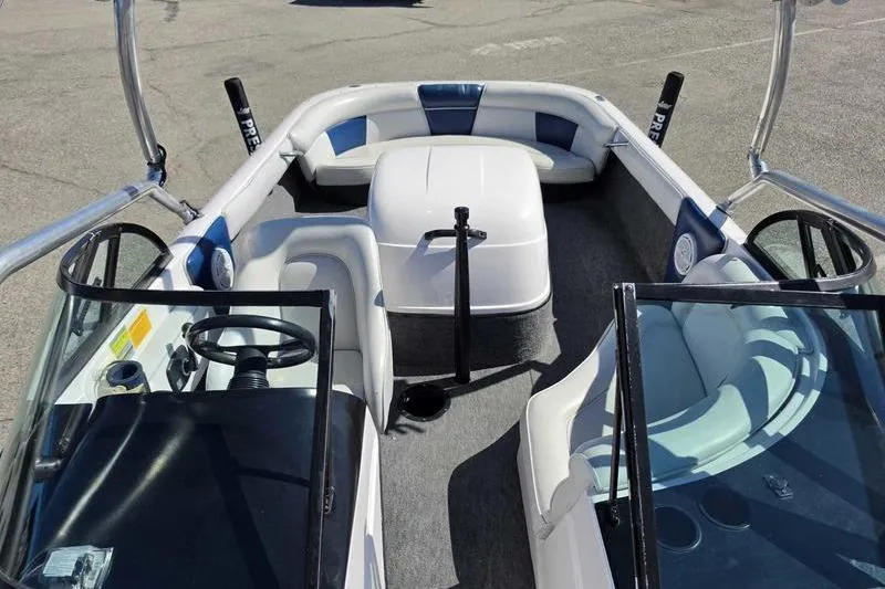 Slide: The Image of 1998 Moomba Outback boat interior with seating and steering wheel, featuring blue and white upholstery. - 5