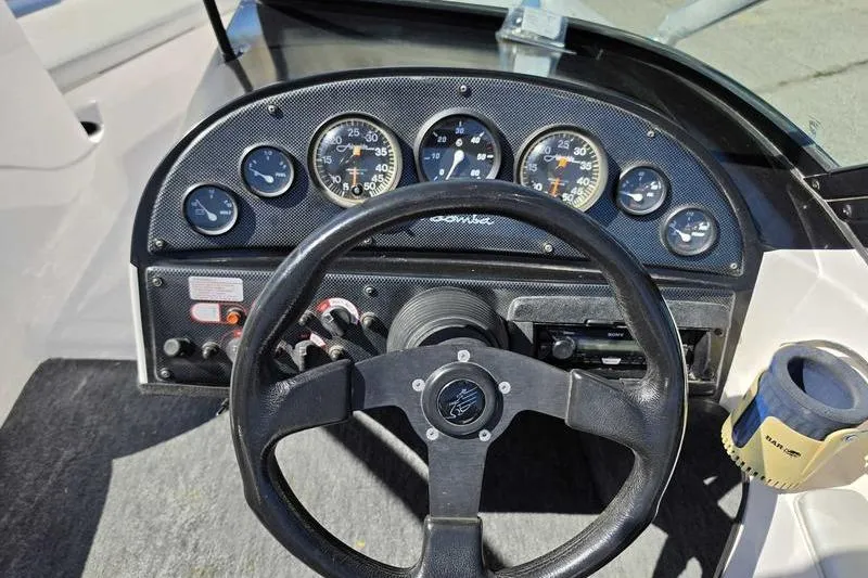 Slide: The Image of 1998 Moomba Outback dashboard with steering wheel and instrument gauges. - 4
