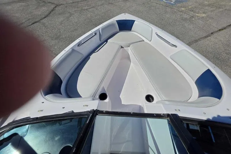 Slide: The Image of 1998 Moomba Outback boat interior with white and blue seating, viewed from above. - 13
