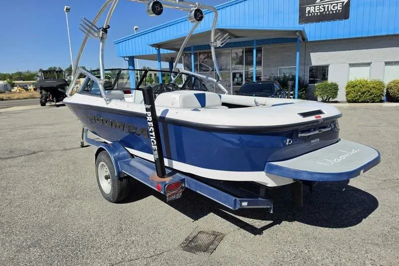 Slide: The Image of 1998 Moomba Outback boat on trailer at Prestige Water Sports dealership. - 10