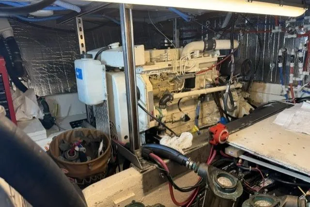Slide: The Image of Engine room of a 1977 Californian 38 Motor Yacht with visible machinery and equipment. - 31