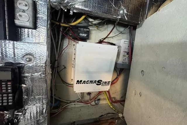Slide: The Image of Electrical system inside a 1977 Californian 38 Motor Yacht, featuring a Magnum inverter. - 27