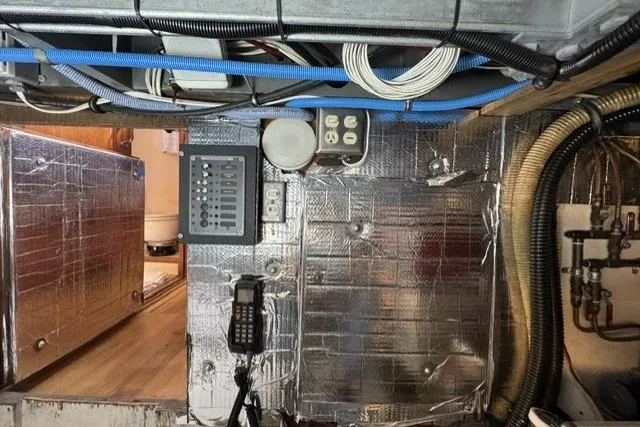 Slide: The Image of Electrical panel and wiring inside a 1977 Californian 38 Motor Yacht engine room. - 25