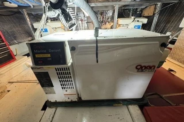 Slide: The Image of Onan marine generator inside a 1977 Californian 38 Motor Yacht engine room. - 21