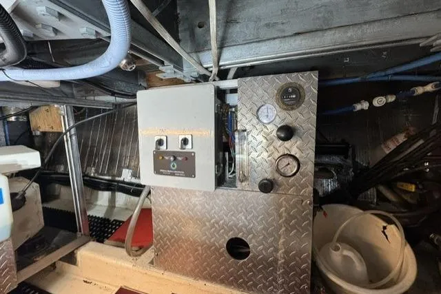 Slide: The Image of Engine room of a 1977 Californian 38 Motor Yacht with control panel and gauges. - 22
