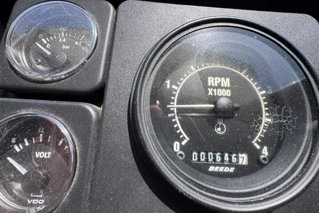 Slide: The Image of Dashboard gauges of a 1977 Californian 38 Motor Yacht, showing RPM, voltage, and pressure. - 8