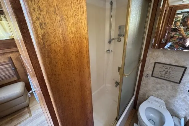 Slide: The Image of 1977 Californian 38 Motor Yacht bathroom with shower and toilet. - 33