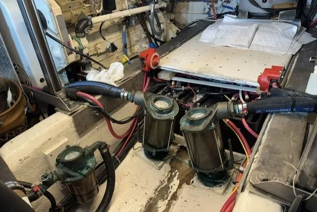 Slide: The Image of Engine room of a 1977 Californian 38 Motor Yacht with visible mechanical components. - 32