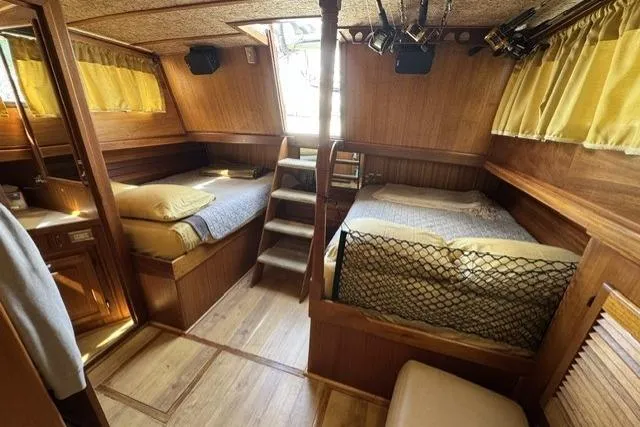 Slide: The Image of 1977 Californian 38 Motor Yacht interior with twin beds and wooden decor. - 36