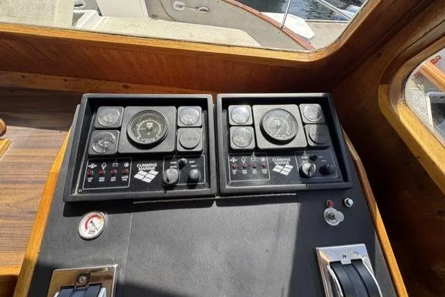 Slide: The Image of Control panel of a 1977 Californian 38 Motor Yacht with gauges and switches. - 7