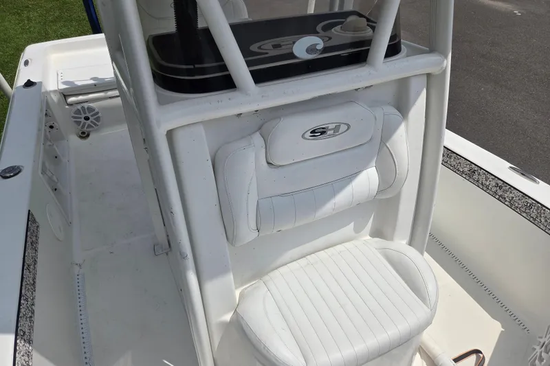 Slide: The Image of 2015 Sea Hunt BX 22 BR boat interior with white seating and console. - 13