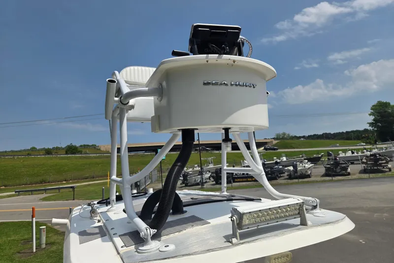 Slide: The Image of 2015 Sea Hunt BX 22 BR boat with elevated helm station and clear sky background. - 8