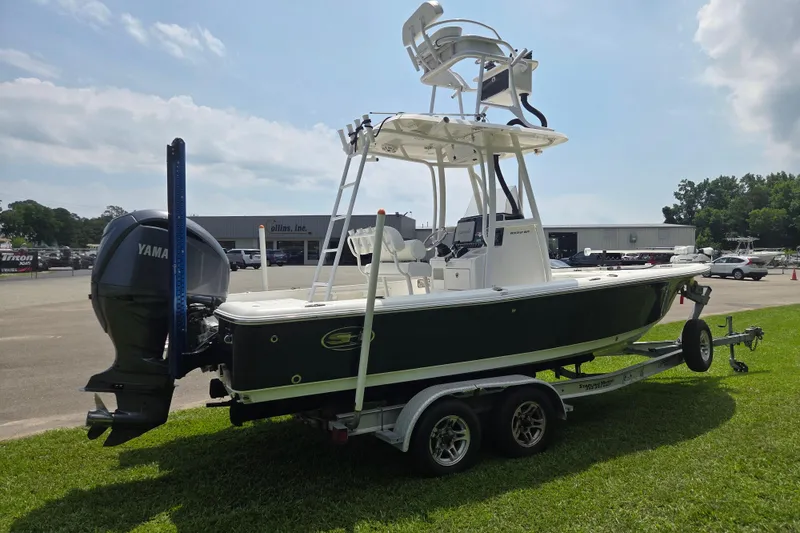 Slide: The Image of 2015 Sea Hunt BX 22 BR boat on trailer with Yamaha outboard motor, parked on grass. - 5