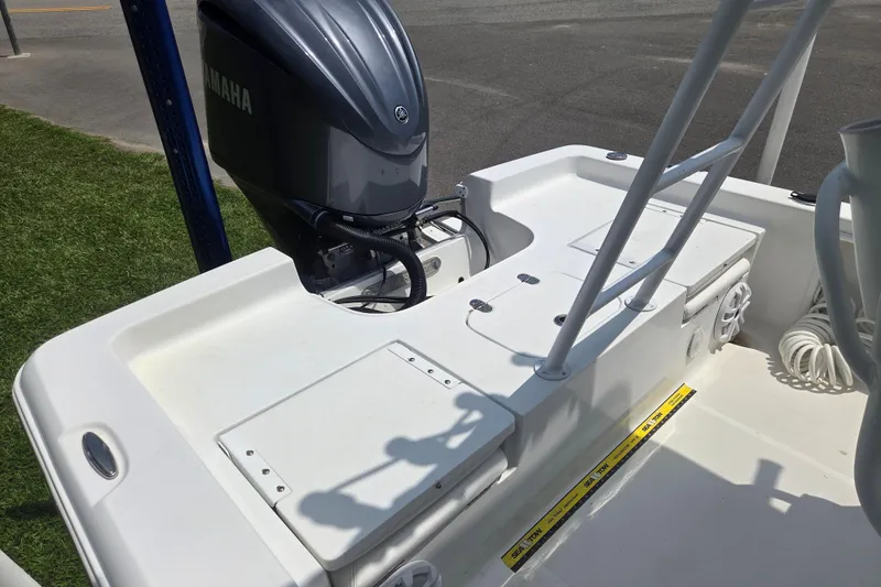 Slide: The Image of 2015 Sea Hunt BX 22 BR boat with Yamaha outboard motor, featuring spacious deck layout. - 10