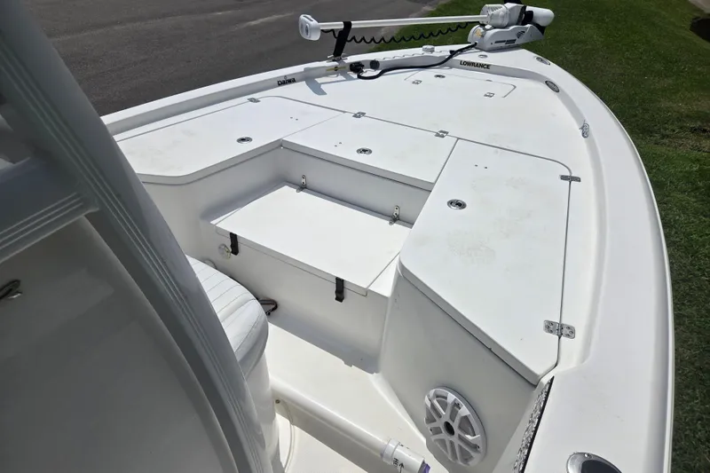 Slide: The Image of 2015 Sea Hunt BX 22 BR boat deck with storage compartments and trolling motor. - 9
