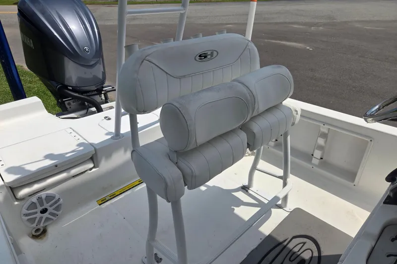 Slide: The Image of 2015 Sea Hunt BX 22 BR boat interior with Yamaha engine and cushioned seating. - 11