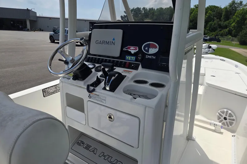 Slide: The Image of 2015 Sea Hunt BX 22 BR boat console with Garmin navigation system and steering wheel. - 12