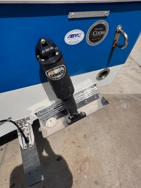 Slide: The Image of Close-up of the stern of a blue Sea Hunt 234 SXS boat with Lenco trim tabs. - 3