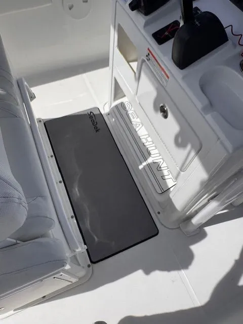 Slide: The Image of Interior view of a Sea Hunt 234 SXS boat with seating and control console. - 20