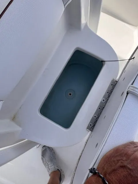 Slide: The Image of A view of a boat with an open storage compartment featuring a blue interior. - 17