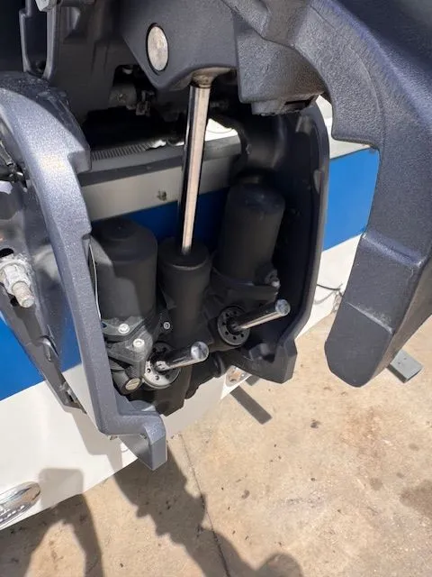 Slide: The Image of Close-up of a boat's outboard motor with hydraulic components. - 5