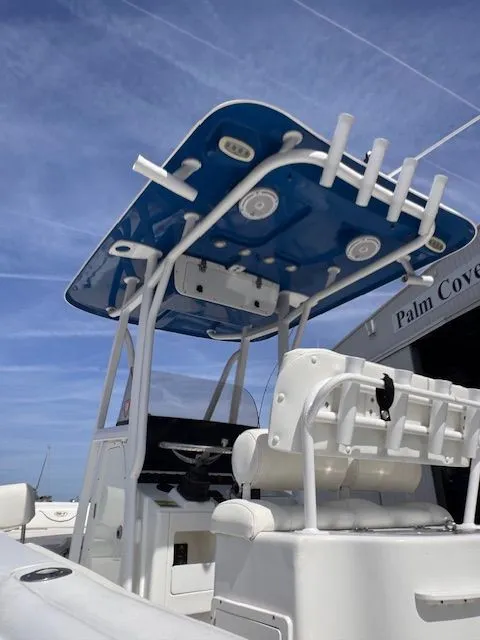 Slide: The Image of The image shows the cockpit of a 2018 Sea Hunt 234 SXS boat with a blue canopy. - 7