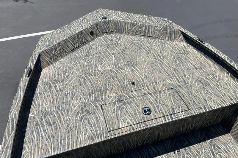 Slide: The Image of 2026 Tracker Grizzly 1860 CC boat with camouflage pattern on deck. - 7